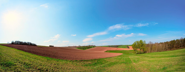 Panorama of spring plowed field