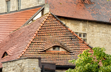 window on the tiled roof, like an eye