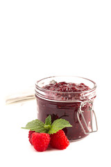 Jar of Homemade Raspberry Jam Isolated on a White Background