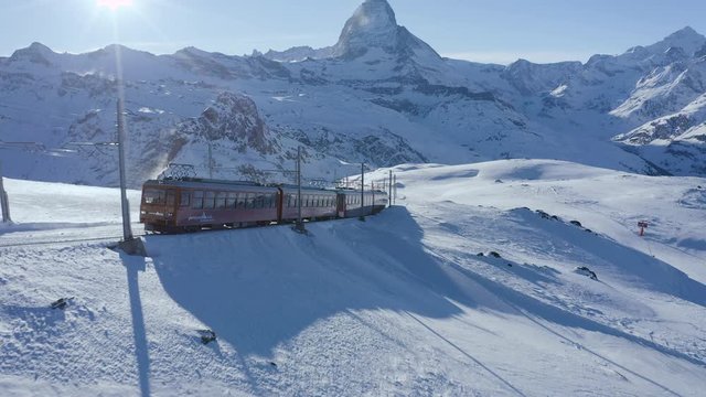 Drone Aerial Flight Over Snow Mountain Train At Sunrise Sunset Winter Wonderland Cinematic Nature 4k Slow Motion
