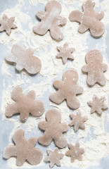 Gingerbread man cookies on baking sheet for Christmas cookie, top view.
