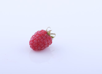 red raspberries on a white background