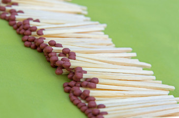Matches isolated on green background