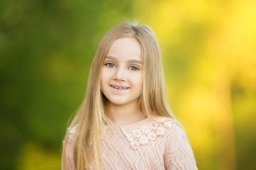 Close-up portrait of beautiful young smiling girll. Summer photo. Gift present. Copy space. Fashion girl. Beauty.