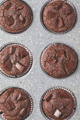 Chocolate vegan muffins in oven dish.