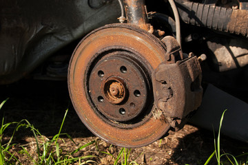 old rusty brake disc on a car