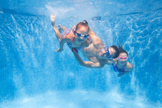 family  in swimming pool