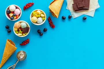 summer dessert with ice cream, cones, wineberry and chocolate on white backgroung top view space for text