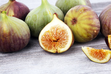 Fresh figs. Food Photo. whole and sliced figs on rustic background.