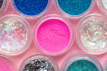 Color glitter. Shimmer, sparkle. For makeup, nails. Shiny powder. Beautiful bright background....