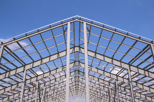 Steel structure of building construction on sky background