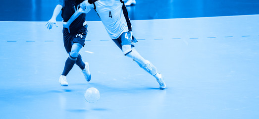 Football Futsal Ball and man Team. Indoor Soccer Sports Hall. Blue filter