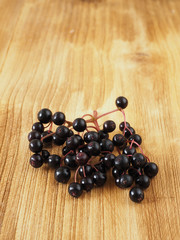Sambucus nigra on the wooden background