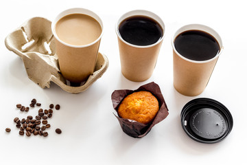Obraz na płótnie Canvas Breakfast with muffin and coffee to-go on white background
