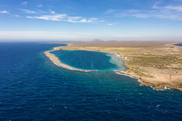 Aerial view of coast of Curaçao in the Caribbean Sea with turquoise water, cliff, beach and...