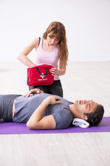 Young man feeling bad during training in first aid concept