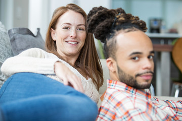 Attractive young couple together at home