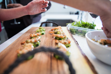 Prepping shrimp in kitchen