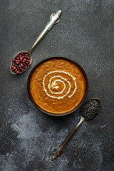 Dal Makhani at dark background. Dal Makhani - traditional indian cuisine puree dish with urad...