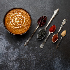Dal Makhani at dark background. Dal Makhani - traditional indian cuisine puree dish with urad...