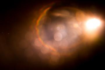 Abstract Natural Sun flare on the black background.