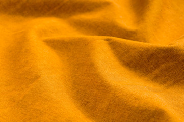 clothing items stonewashed cotton fabric texture with seams, clasps, buttons and rivets, macro