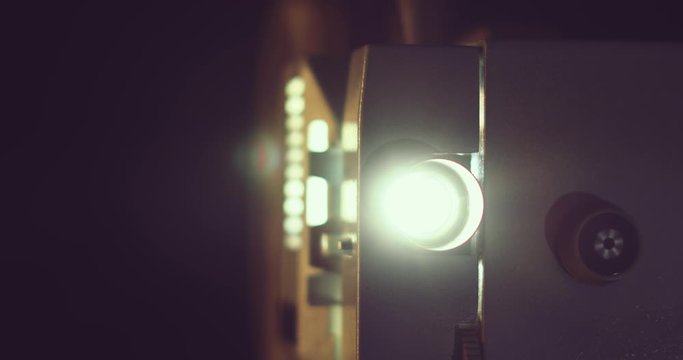 closeup of retro 8mm film projector. dolly shot