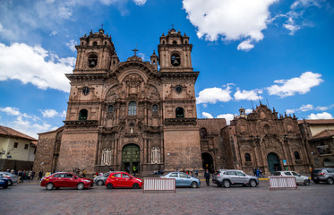 Cusco, Peru - 05/24/2019: Spanish Colonial La Compania in the Plaza De Armas in Cusco, Peru.