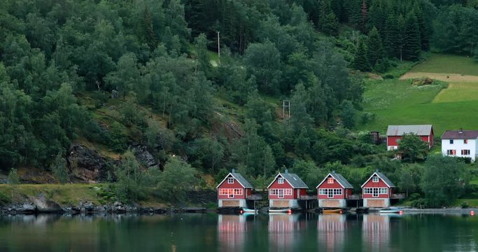 Flam, Norway. Famous Red Wooden Docks In Summer Evening. Small Tourist Town Of Flam On Western Side Of Norway Deep In Fjords. Famous Norwegian Landmark And Popular Destination