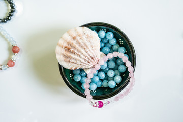 High angle view on crystal semiprecious stone beads bracelets gems natural stones for manifesting...