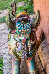 Sacred Valley, Peru - 05/21/2019: Decorative bull at the Awanacancha Textile site in Peru outside...