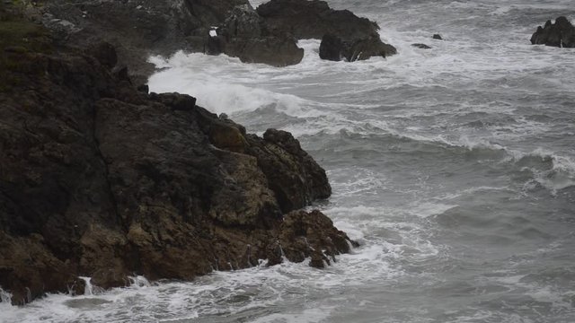 The breaking of the waves at the cliffs of the cantabrian coast, Comillas, Spain