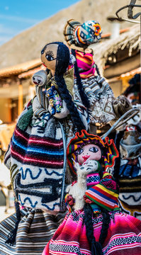 Sacred Valley, Peru - 05/21/2019: Colorful dolls outside a shop in Ollantaytambo, Peru in the Sacred Valley.