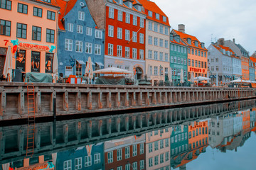 Copenhagen, Denmark - 17 August, 2019: Summer morning view of Nyhavn pier with color buildings,...
