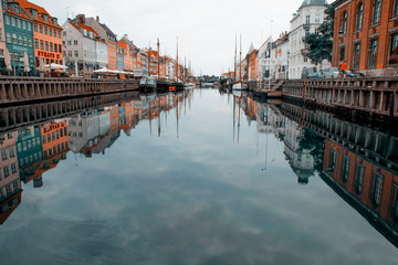 Fototapeta premium Copenhagen, Denmark - 17 August, 2019: Nyhavn pier with color buildings, ships, yachts and other boats in the old part of town of Copenhagen, Denmark
