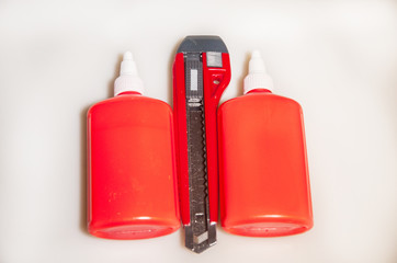 Red stationery. Glue and knife
