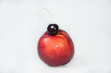 Composition on white background with fruit. Peach and cherrys