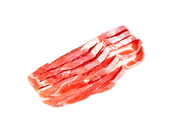 Panceta thin slices of raw pork on white background.