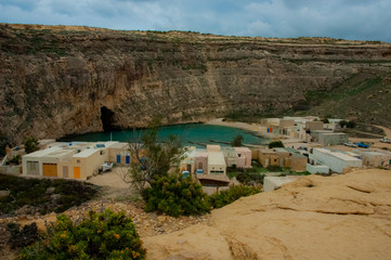 Fototapeta premium Malta beach with rocks and blue water