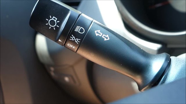 Hand switching on car turn signal