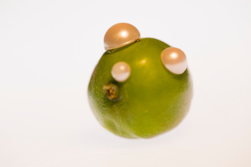Little green apple decorated with beads 