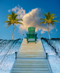 Digitall manipulated image of an adirondack chair sitting on a dock and a waterfall.