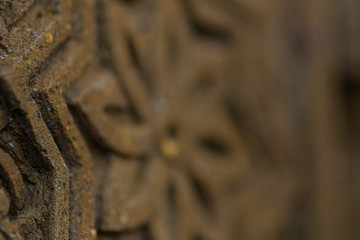 Macro rectangular religios carved stone ornament