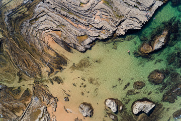 Aerial view of the rock formations at the Carreagem Beach in Aljezur, Algarve;
