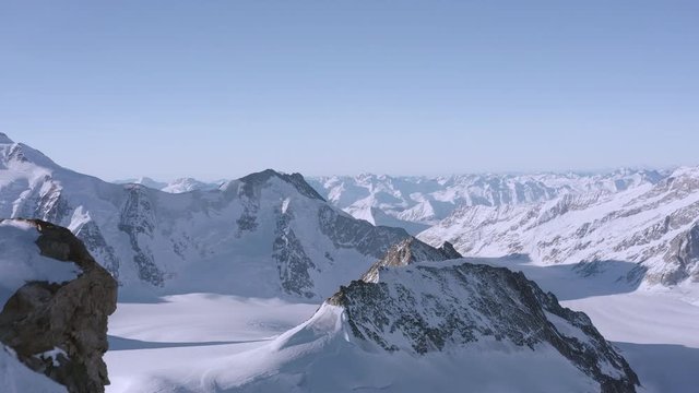 Drone Aerial Flight Over Snow Mountain Range Golden Hour Winter Wonderland God'S View 4k Slow Motion
