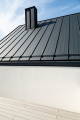 Luxurious modern house in a developer standard. Composite deck terrace and graphite sheet metal...