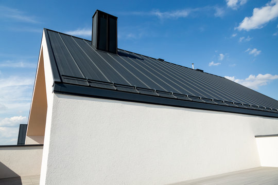 Luxurious modern house in a developer standard. Composite deck terrace and graphite sheet metal roof.