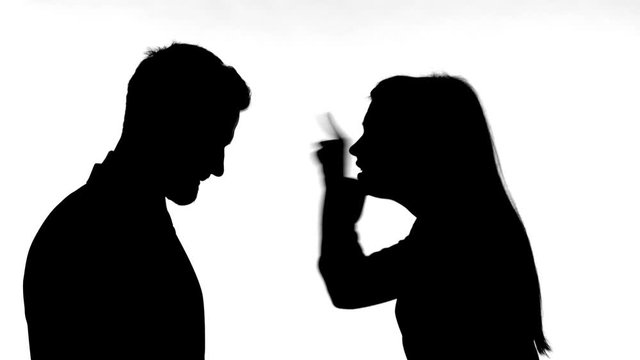 Silhouette of Woman Fighting with Man against White Background
