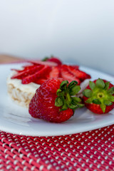 Rice biscuit with cream and strawberries.