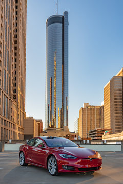 Red Tesla Model S on Atlanta Rooftop Parked in the Summer